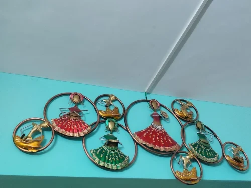 Ring doll metal wall art